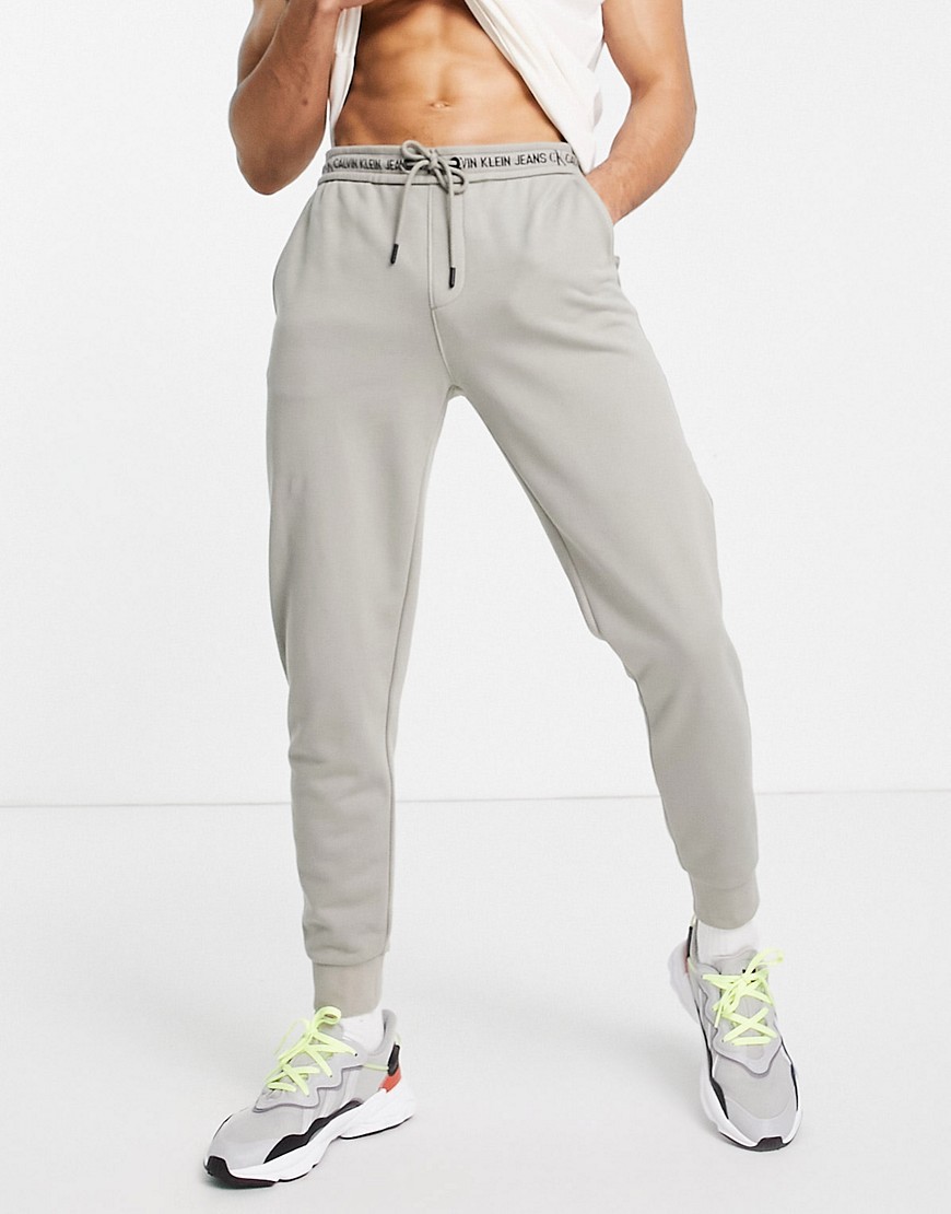 Calvin Klein Jeans taping logo joggers in stone-Neutral