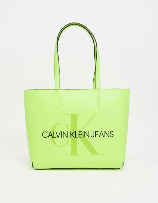 Calvin Klein Jeans tote bag with large logo in yellow neon | ASOS