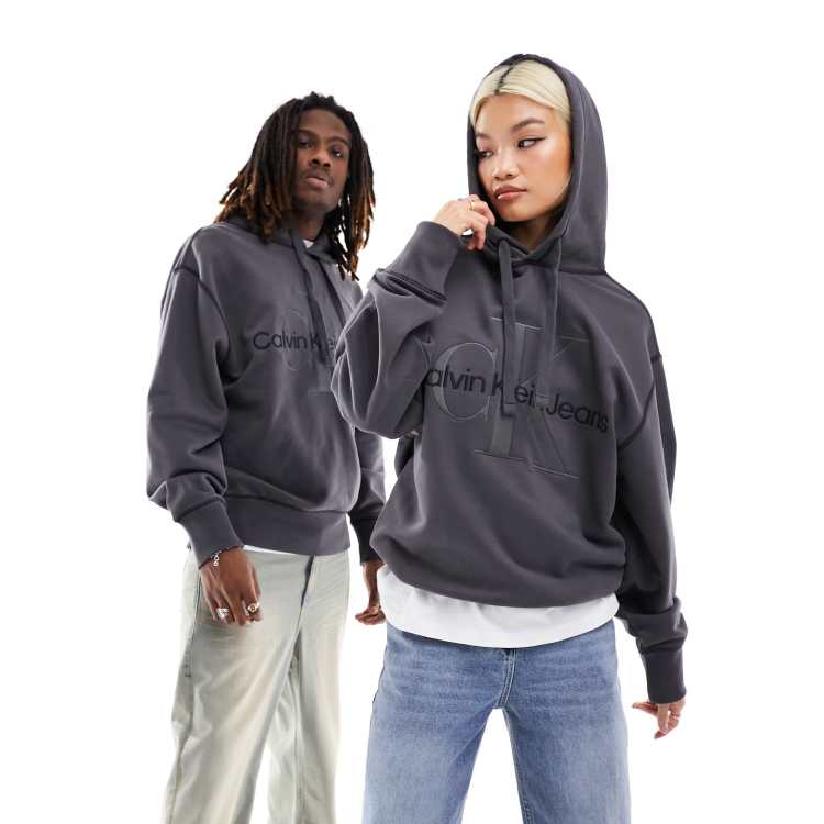 Calvin Klein Jeans Unisex Kapuzenpullover in verwaschenem Schwarz mit Monogramm Logo