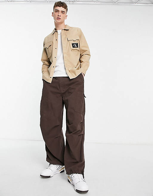 Calvin Klein Jeans utility cargo relaxed fit overshirt in beige | ASOS