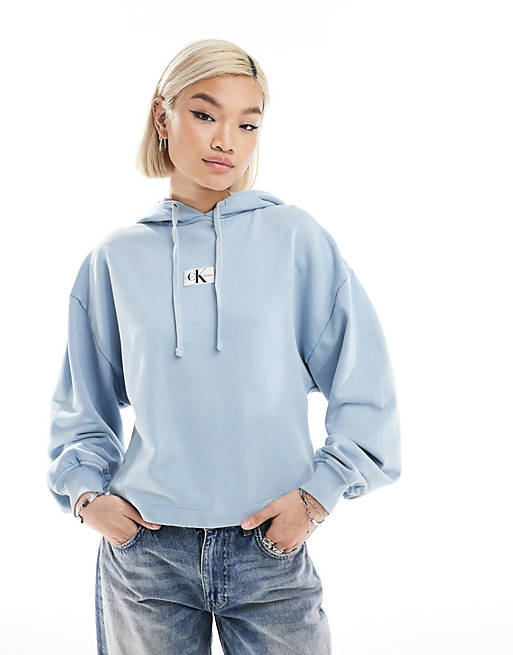 Calvin Klein Jeans washed woven label hoodie in blue | ASOS