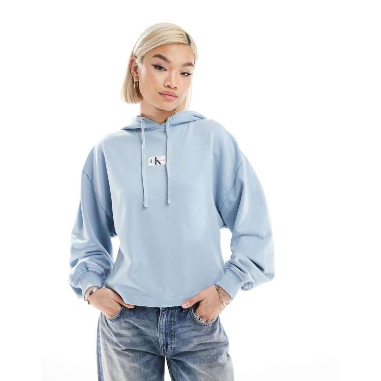 Calvin Klein Jeans washed woven label hoodie in blue ASOS