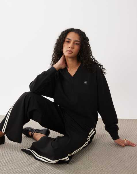Calvin Klein Jeans woven label long sleeve v -neck sweatshirt in black - view 1