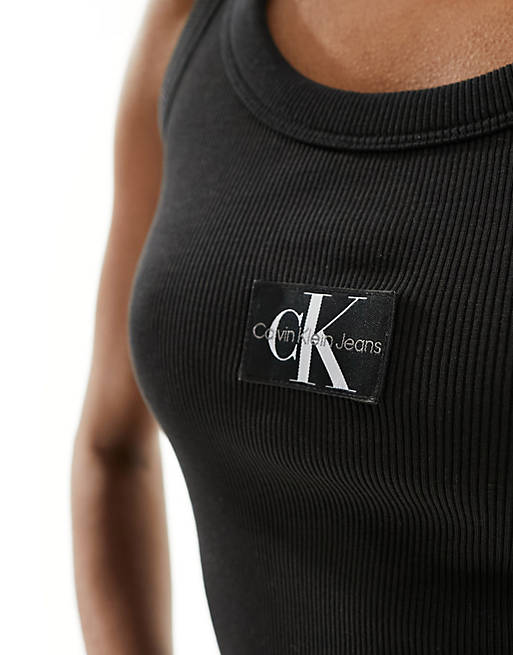 Calvin Klein Jeans woven label ribbed tank top in black | ASOS