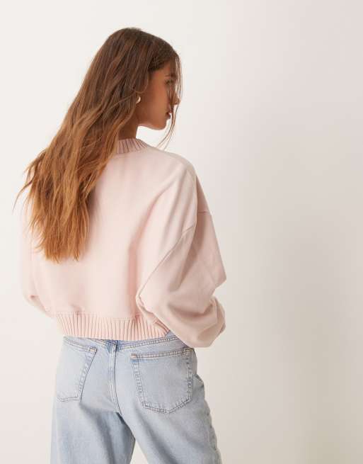 Calvin Klein Jeans woven label v-neck sweatshirt in pink | ASOS
