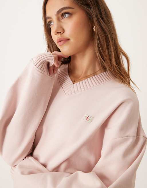Calvin Klein Jeans woven label v-neck sweatshirt in pink | ASOS