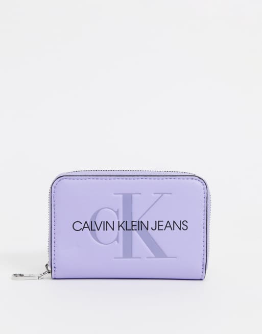 Calvin Klein Jeans zip around purse in lilac ASOS