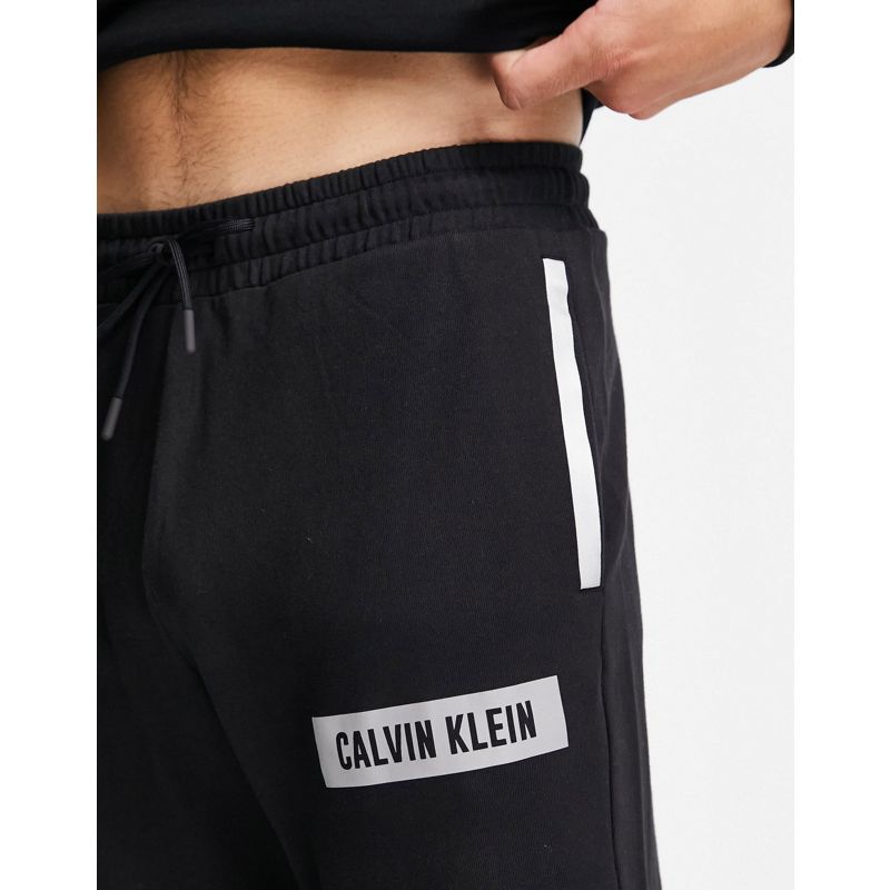 Designer JFkMa Calvin Klein - Joggers con polsino nero CK con riquadro riflettente con logo