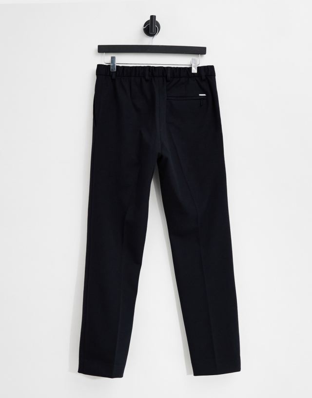 Calvin Klein - knitted trousers in navy