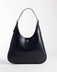 Calvin Klein large sleek bucket bag wit gold details in black