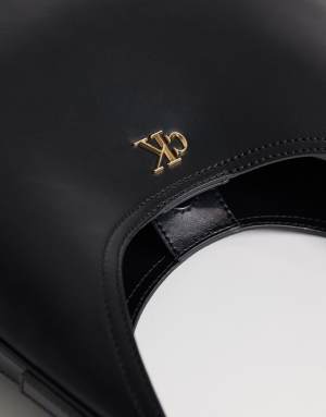 Calvin Klein large sleek bucket bag wit gold details in black