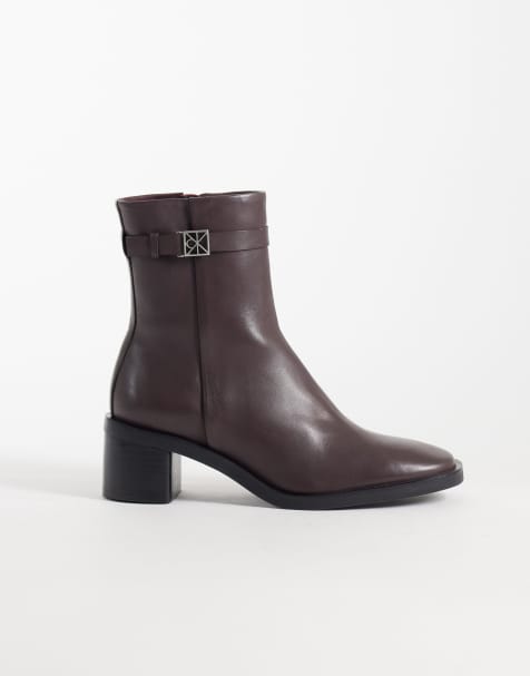 Calvin Klein leather ankle boots with block heels and logo buckle detailing in chocolate brown - view 1
