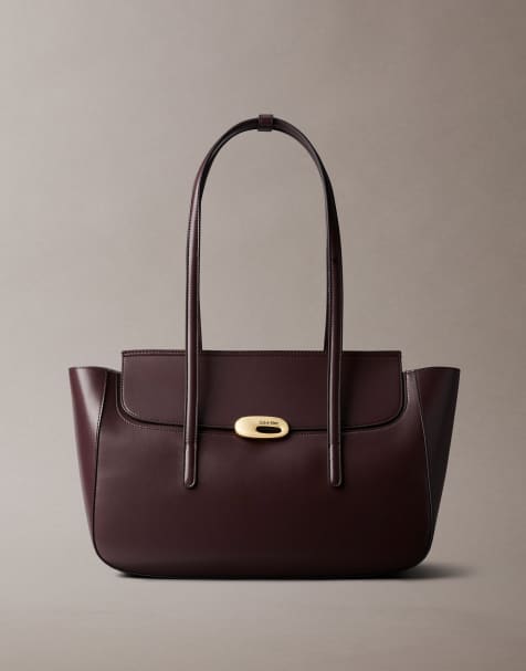 Calvin Klein leather medium tote bag with hardware detail in deep brown - view 1