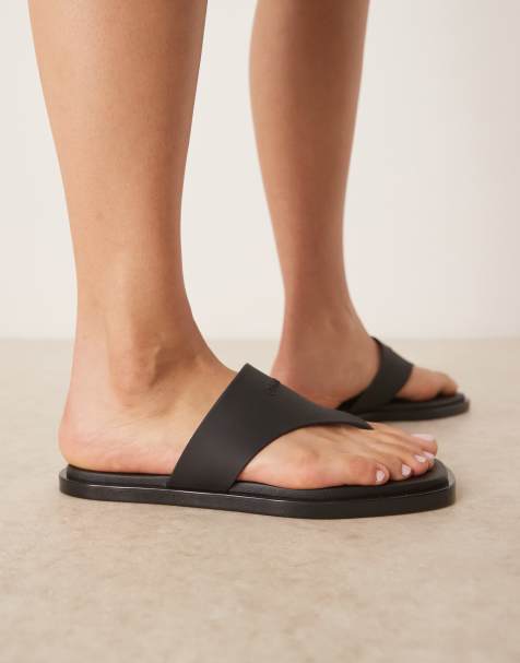 Calvin Klein leather thongs in black - view 1