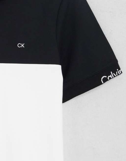 Calvin Klein liquid touch blocking logo polo in white/black