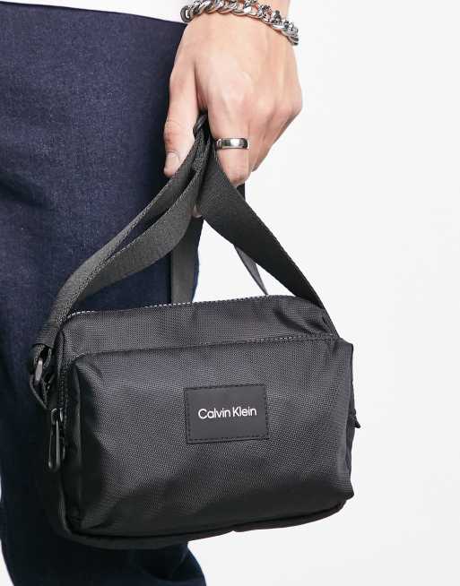 Calvin Klein logo camera bag in black ASOS