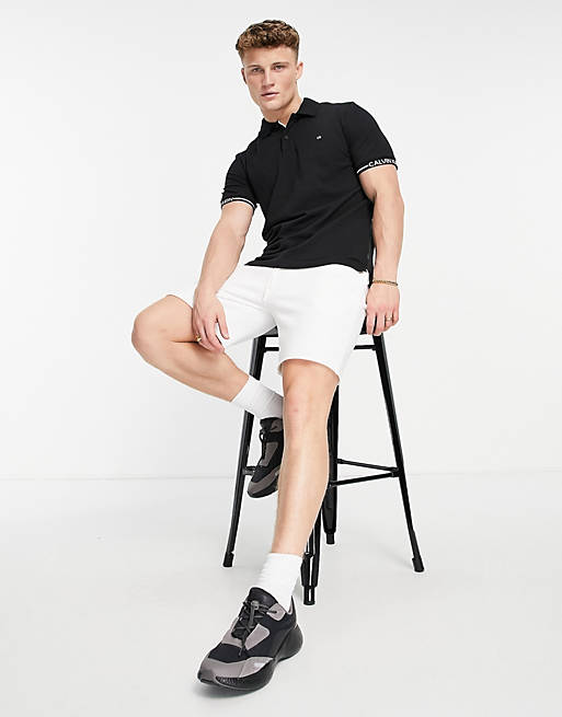 Calvin Klein logo cuff slim fit polo shirt in black | ASOS