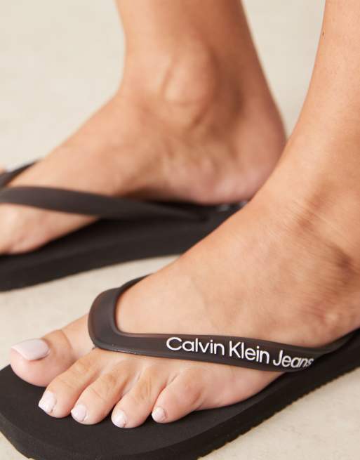 Calvin Klein logo flip flops in black, 3 of 4