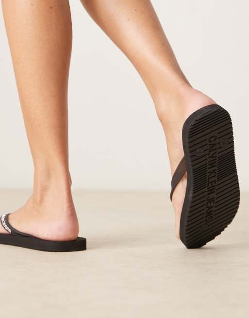 Calvin Klein logo flip flops in black, 4 of 4