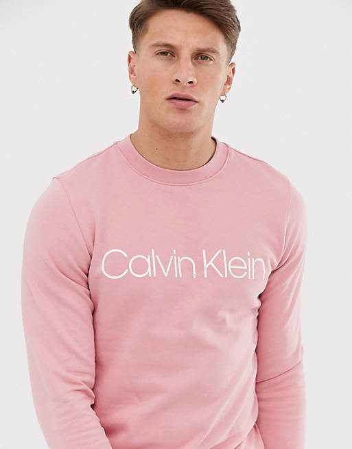 Calvin Klein logo front crew neck sweatshirt in pink | ASOS