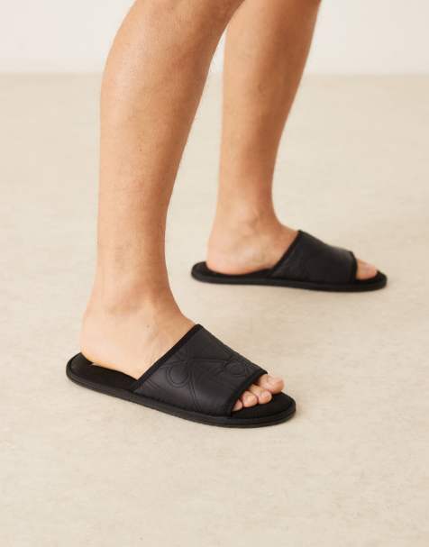 Calvin Klein logo mule slippers in black - view 1