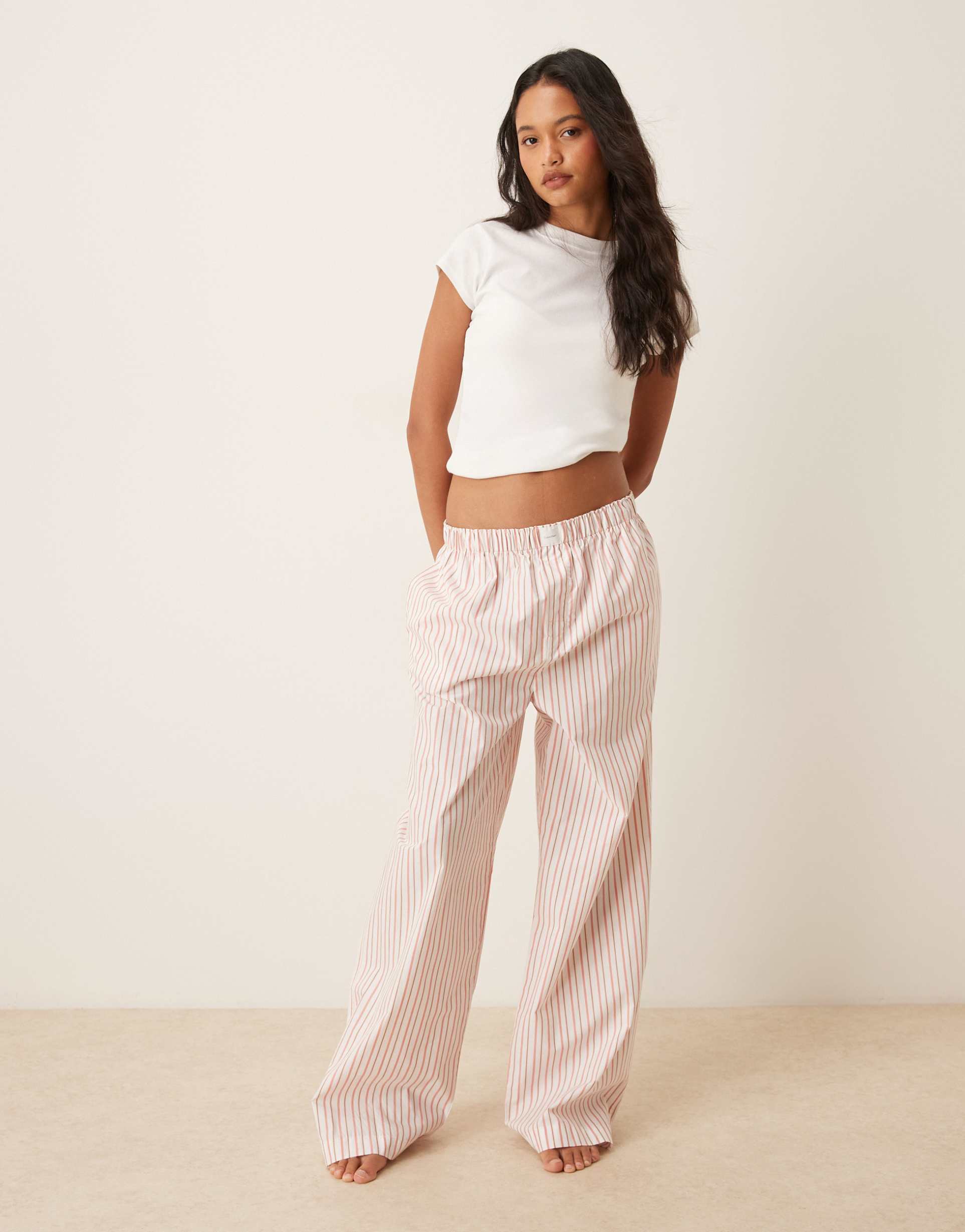 calvin klein logo poplin pants in peach stripe