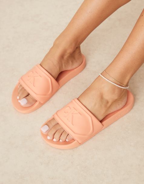 Calvin Klein logo puff slides in pastel orange - view 1