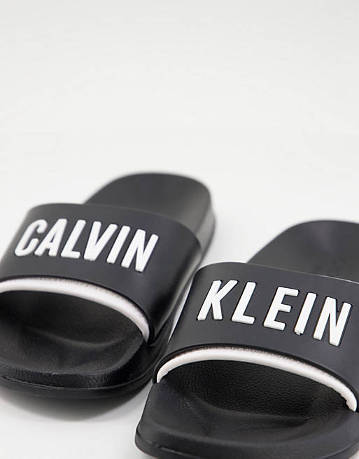 Calvin Klein logo slider in black | ASOS
