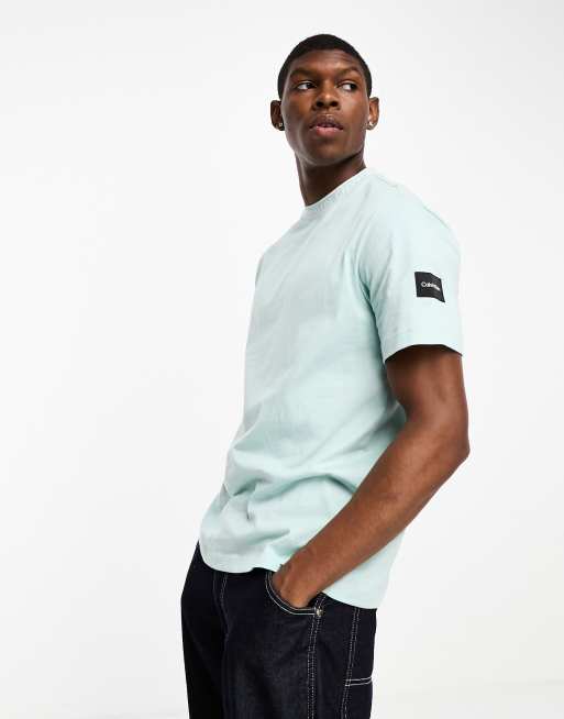 Calvin Klein logo tape collar and side patch t-shirt in baby blue | ASOS