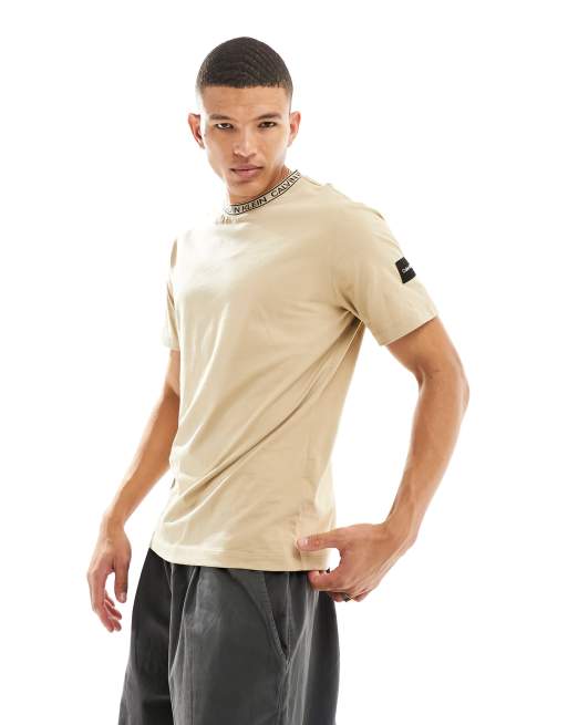 Calvin Klein logo tape collar and side patch t-shirt in beige | ASOS