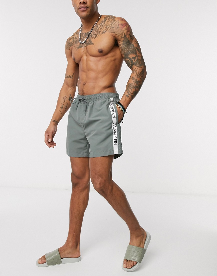 Calvin Klein logo tape swim shorts in grey