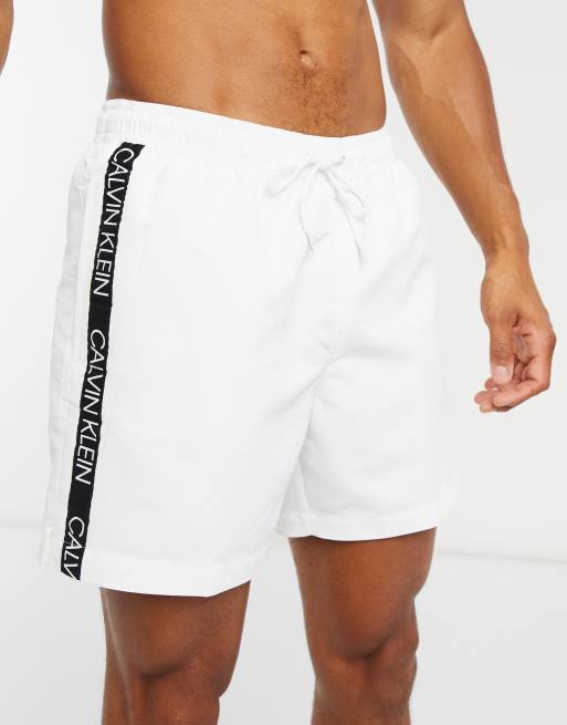 Calvin Klein logo tape swim shorts in white