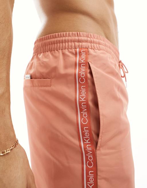 Pink calvin best sale klein swim shorts