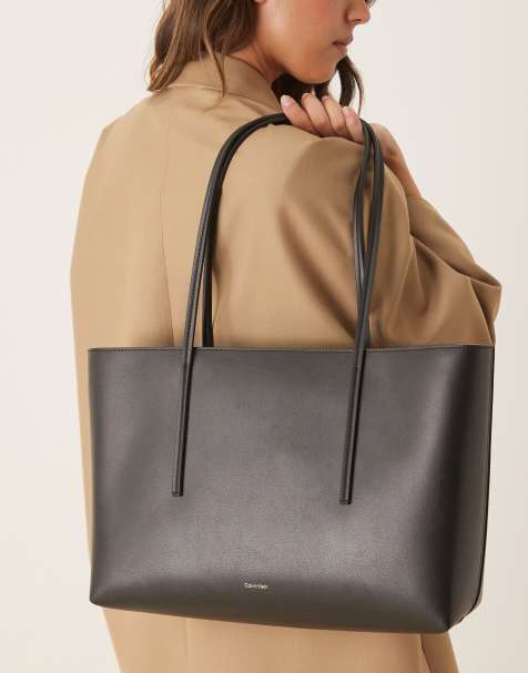 Calvin Klein logo tote bag with pouch in black - view 1