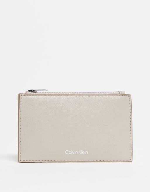 Calvin Klein logo zip purse in beige
