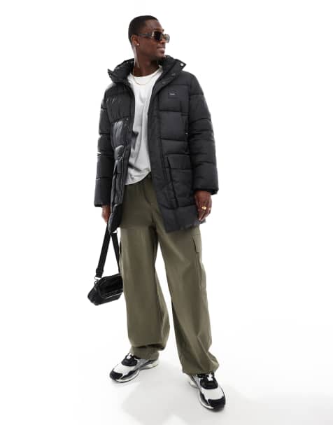Calvin Klein long hooded quilted padded jacket in black - view 1