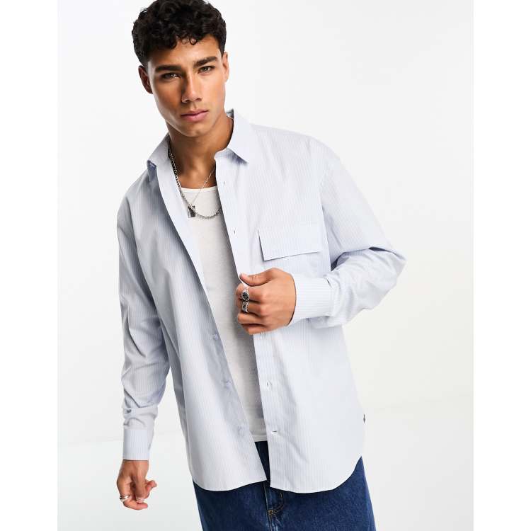 Calvin Klein long sleeve relaxed stripe shirt in blue | ASOS