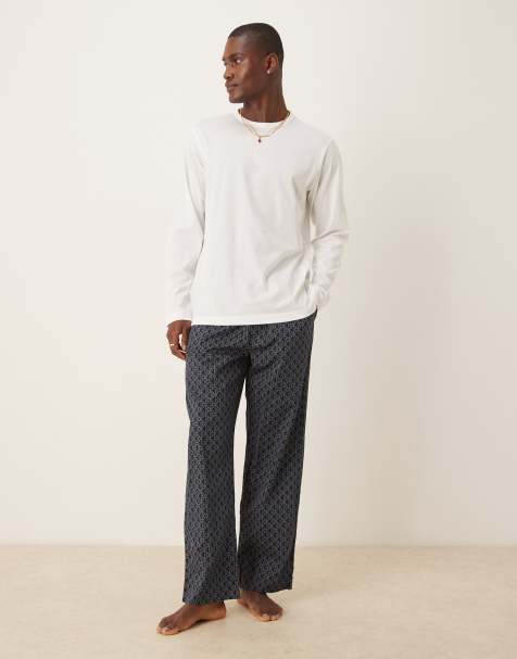 Calvin Klein long sleeve top and trousers pyjama set in white and logo print - view 1