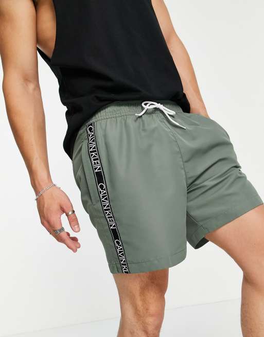 Calvin Klein medium drawstring swim shorts in khaki | ASOS