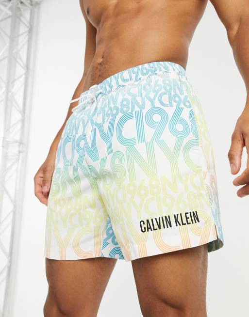 Calvin Klein medium length swim shorts in typo print