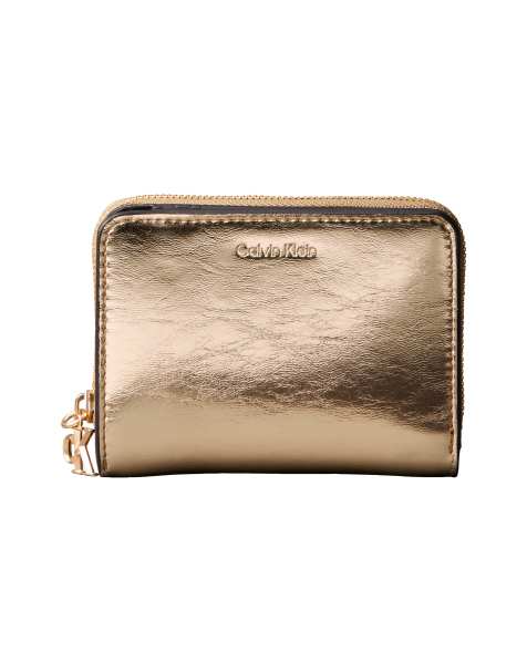 Calvin Klein metallic zip wallet in gold - view 1