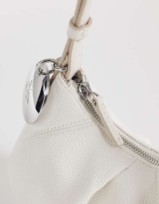 Calvin Klein mini shoulder bag with metal hardware in white | ASOS