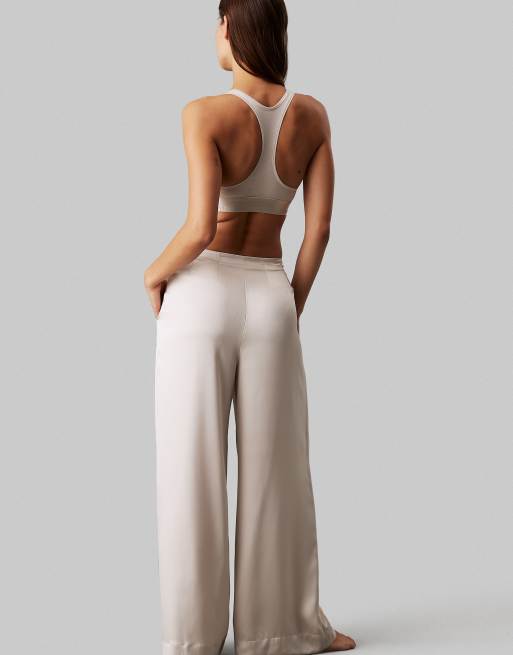 Calvin Klein Modern Cotton unlined racerback bralet with metallic logo taping in cream, 2 of 4