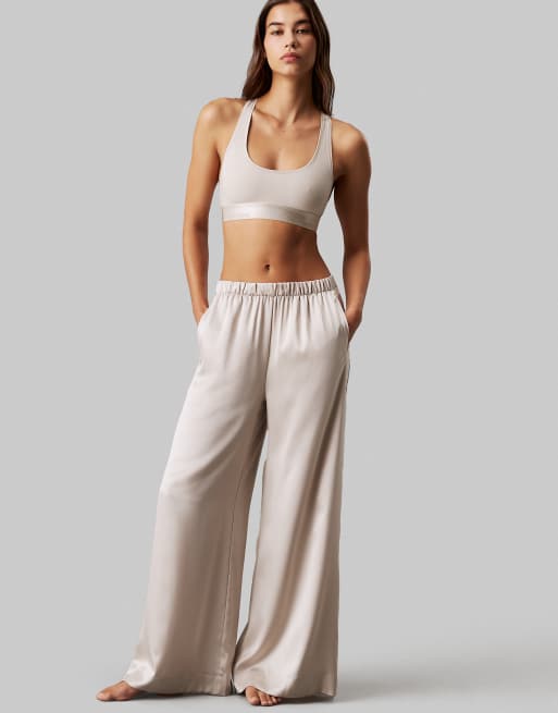 Calvin Klein Modern Cotton unlined racerback bralet with metallic logo taping in cream, 4 of 4