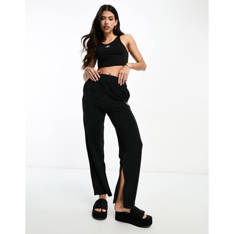 Calvin Klein flared pants with tie waist in black