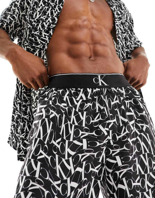 Calvin Klein monogram print long waist band swim shorts in black