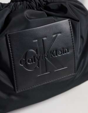 Calvin Klein nylon drawstring crossbody bag with bold logo in black