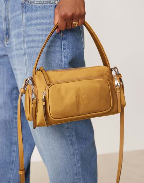 Calvin Klein nylon pocket shoulder bag in brown - view 1