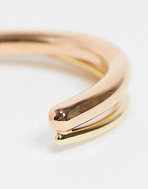 Calvin Klein open double cross over bangle in gold and rose gold | ASOS