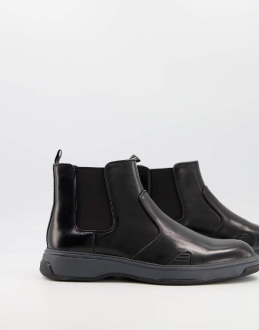 Calvin Klein – Pancho – Svarta grova chelseaboots i läder